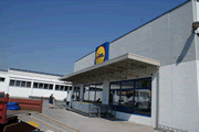 opera di montaggio rivestimento esterno per abellimento capannone lidl in provincia di milano